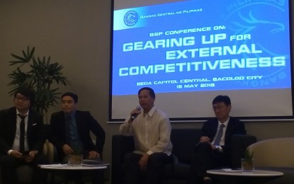 <p><strong>BSP CONFERENCE.</strong> Joselito Basilio (2<sup>nd</sup> from left), acting deputy director of BSP Department of Economic Research, with Justin Ray Angelo Fernandez, bank officer V of BSP Department of Economic Research; Ramon Clarete, professor of UP School of Economics; and Donghyun Park, principal economist of Asian Development Bank, during the open forum of the BSP Conference on Gearing Up for External Competitiveness held in Bacolod City on Tuesday (May 15, 2018). <em>(Photo by Nanette L. Guadalquiver)</em></p>